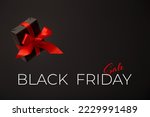 Black Friday sale. Black gift box with red bow floating in air on black background. Discount, online shopping concept