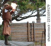 Small photo of A musket is fired at Fountain of Youth Archaeological Park