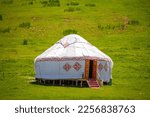 Small photo of Yurt. National ancient house of the peoples of Kazakhstan and Asian countries. National Housing. Yurts on the background of a green meadow and highlands.