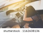 Small photo of Woman feeling carsick with sleepy tired and have a headache while driving car