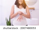 Small photo of Woman with rash or papule and scratch on her hands from allergies,Health allergy skin care problem,Psoriasis vulgaris