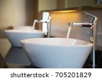 Interior of bathroom with sink basin faucet. Open chrome faucet washbasin. Modern design of bathroom