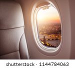 Airplane interior with window view of London city, Europe. Concept of travel and air transportation