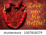 Small photo of Valentine's day card with the inscription "Love you My Hottie!". heart of hot chili peppers on a red background. slang used