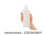 Small photo of Young adult woman hand holding big plastic pump bottle isolated on white background. Care about clean and soft body skin. Daily beauty product. Closeup. Front view.