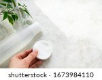 hand holding cotton pads and... | Shutterstock . vector #1673984110