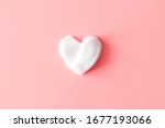 heart from soap foam on pink... | Shutterstock . vector #1677193066