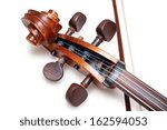 pegbox of old threadbare antique cello with bow isolated over white background with shadow