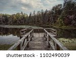 The stunning views, natural beauty, and the surrounding Jefferson National Forest, while standing on the dock at  the Peaks of Otter, Blue Ridge Parkway 