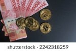 Small photo of Jakarta, Indonesia - December 27, 2022: Bitcoin, a mainstream digital currency, the largest cryptocurrency by market cap. Bitcoins Mining Concept Illustration.