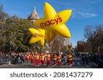 Small photo of NEW YORK, NY - NOVEMBER 25: Macy's Yellow Star balloon moves through the 95th Annual Macy's Thanksgiving Day Parade on November 25, 2021 in New York City.