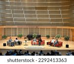Small photo of Willimantic, Connecticut, USA - April 22, 2023: panel discussion at Eastern Connecticut State University. Inside auditorium at Fine Arts Instructional Center with people on stage.