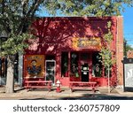 Small photo of Longmont, Colorado, USA - September 4, 2023: Exterior of Josie's Tacos business on Main Street in downtown area. Bright red building with picnic benches out front.