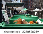 Small photo of NYC Curbside Compost Collection. Neighborhood residents drop off their unused food, leftovers, and non edible parts of vegetation. Recycling food to provide nutrients to the soil of new crops.