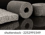 Small photo of Synthetic metal foam (Sponge-like metal foam or Sintered Metal). Detail of open-cell metal foam. Metallic foam like tube or hollow cylinder.