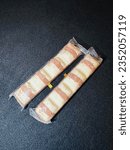 Small photo of Kinder bueno chocolate candy bar on white, black background. Kinder bueno by Italian confectionery manufacturer ferrero