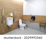 Toilet for handicap, blurred background.