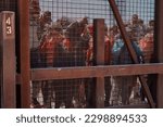 Small photo of El Paso, TX USA May 5, 2023 Migrants on the U.S. side along the border in El Paso, TX. Some have set up encampments.