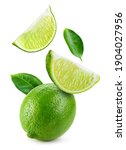 Small photo of Lime fruit isolate. Falling lime slices with leaves. Flying fruit. Lime whole, half, slice, leaf on white. Full depth of field.