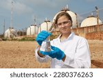 Small photo of Junior Biologist or little girl natural science check drain water from factory ,Water environment pollution problem concept , water science collect dead fish from factory wast water