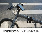 Smartphone holder for bike on  pedestrian crossing background. Cell phone holder on bicycle to use gps for guidance in city center 