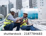Small photo of Group of African American engineer worker working in sewer pipes area at construction site. Male engineer and woman engineer work with laptop computer for maintenance sewer pipes, water tank