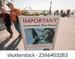 Small photo of New York NY USA-October 1, 2013 A sign in Battery Park in New York where ferries to the Statue of Liberty launch informs tourists that the statue is closed due to a government shutdown