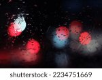 Blur photo of wet window glass exposed to light at night