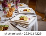 Small photo of Jewish wedding event party with plate set up, cutlery and food.