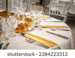 table décor ideas for Jewish orthodox Hasidic wedding, event. Place settings with flowers and cutlery. Kosher food and candles