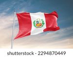 Waving flag of Peru in beautiful sky. Peru flag for independence day. The symbol of the state on wavy fabric.