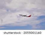 Small photo of Madrid, Spain; 09-25-2021: Side view of an Airbus A330 aircraft of the Spanish airline Iberia during the takeoff maneuver