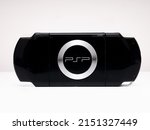 Small photo of Madrid, Spain; 04-30-2022: Rear view of the famous Sony PSP (Playstation Portable) video game console in black on a white background