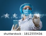 Health care rating concept. The doctor clicks on the stars on a blue background.