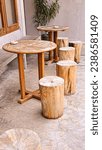 Small photo of Appearance of a round wooden table and log stool chairs, in the outdoor area of ​​Lind's Ice Cream Cafe and Resto, Pondok Indraprasta Semarang.