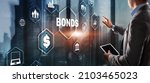 Small photo of Businessman clicks a bonds virtual screen. Bond Finance Banking Technology concept. Trade Market Network
