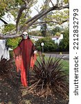 Small photo of Skeleton with Red Gauzy Robe Flowing Under the Trees
