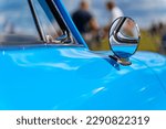 Blue oldtimer car round rearview mirror