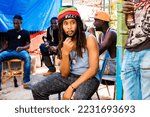 Small photo of St Andrew, Jamaica January 01, 2022: Rastafatian Reggae Artiste Jah Izrehl parades through a poor people market in Papine Jamaica