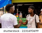 Small photo of St Andrew, Jamaica January 01, 2022: Rastafatian Reggae Artiste Jah Izrehl parades through a poor people market in Papine Jamaica