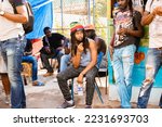 Small photo of St Andrew, Jamaica January 01, 2022: Rastafatian Reggae Artiste Jah Izrehl parades through a poor people market in Papine Jamaica