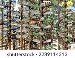 Small photo of Oro Grande, California, USA. June 14, 2014. Elmer's Bottle Tree Ranch. Eclectic Collection of Bottles and nic nacs.