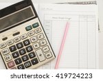 Small photo of notebook years cash account balance brought forward income and expenses