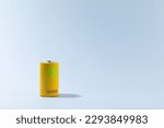 Small photo of Top view of alkaline batteries or NiMH rechargeable cells on blue background