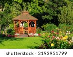 Cedar wooden gazebo at the rose garden in the city park of Penticton, British Columbia, Canada located in the Okanagan Valley.
