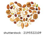 Small photo of Pattern of nuts in the form of a heart isolated on white background Pecans macadamia nuts brazil nuts walnuts almonds hazelnuts pistachios cashews peanuts, pine nuts Top view Flat Đˇopy space