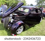Small photo of GRANBY QUEBEC CANADA 07 30 2023: 1936 Ford 3 Window Coupe (Custom) . The windshield cranks out and the rear window cranks down.