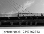 Small photo of LONDON UNITED KINGDOM 06 19 2023: The Hungerford Bridge crosses the River Thames in London, and lies between Waterloo Bridge and Westminster Bridge and which are named the Golden Jubilee Bridges
