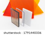 Small photo of Solid Polycarbonate Sheet. Brown and transparent. Acrylic Plastic glass. Colored pc sheet on background