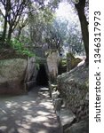 Small photo of Cuma, Naples, Campania, Italy - 17 March 2019: The initial part of the long corridor that characterizes the Sybil's Cave